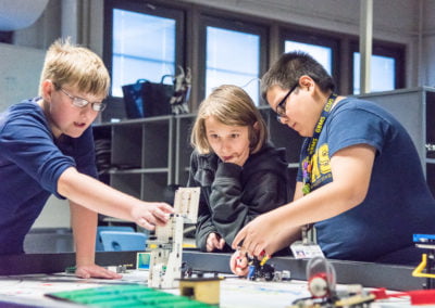 kids working with lego robotics